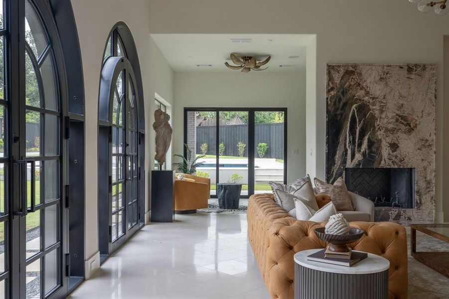 Living room featuring tile patterned floors and a fireplace