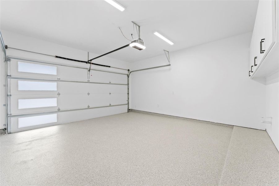 polyaspartic sealed floor with belt drive built in camera quite opener