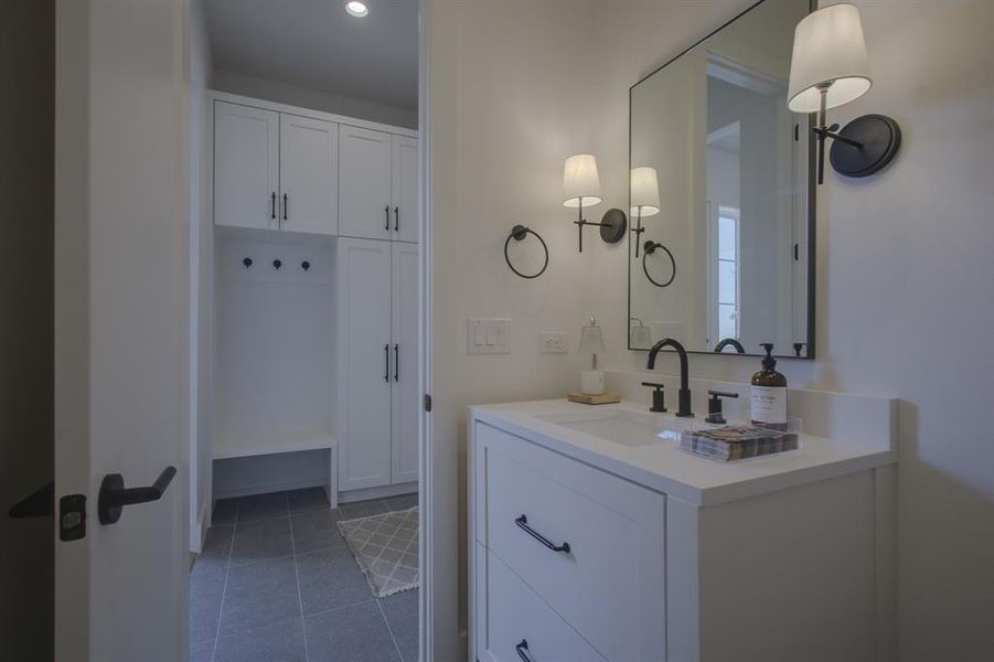 Bathroom featuring tile patterned floors and vanity