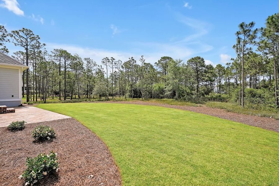 Front exterior of a new home in St. James, Southport, NC, highlighting curb appeal (Image 21).
