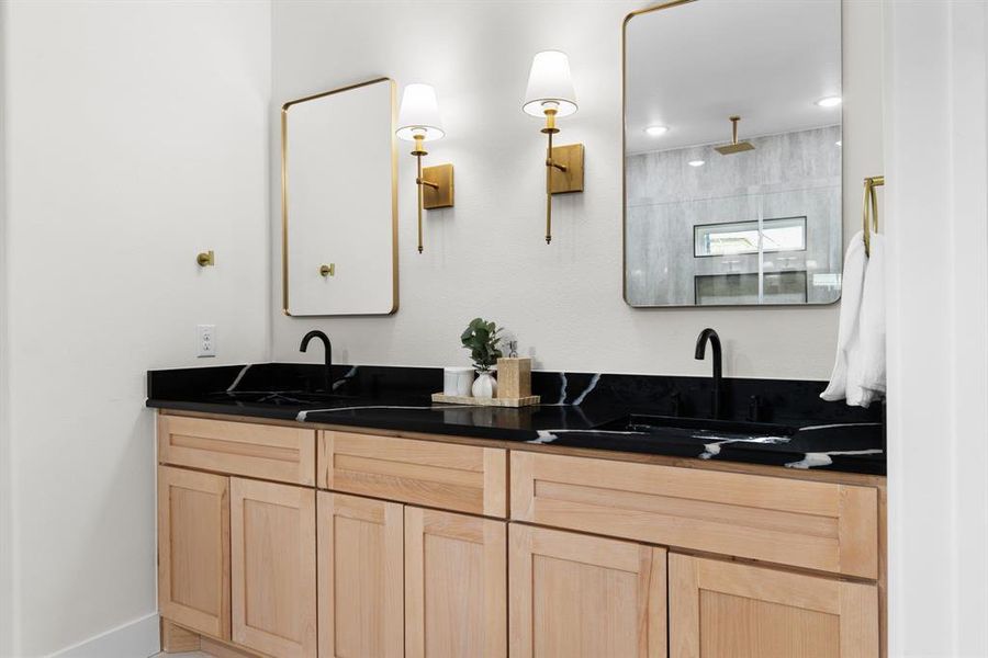 Bathroom featuring vanity and tiled shower