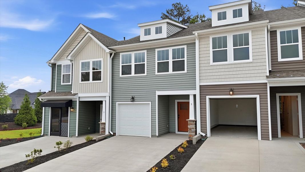 Exceptional home with tasteful exterior finishes and a thoughtfully designed façade at the new Anna's Pointe community