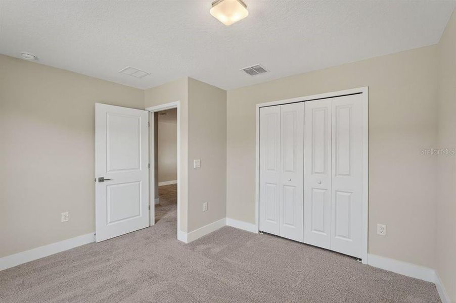 Spacious, unfurnished interior of a new home in Gray Hawk at Hole Two, Daytona Beach (Image 38).