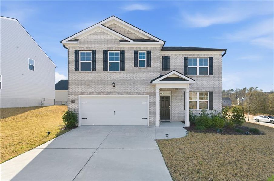 Front exterior of a new home in Brooks Village, Dacula, GA, highlighting curb appeal (Image 30).
