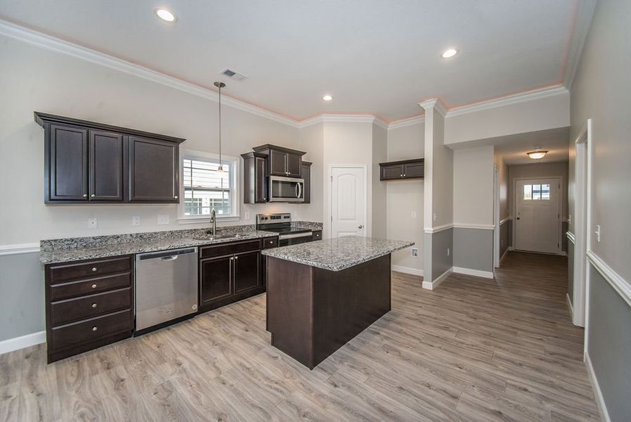 Representative furnished interior of a home built from the Quincy by Enchanted Homes in Lonesome Dove, San Antonio (Image 17).