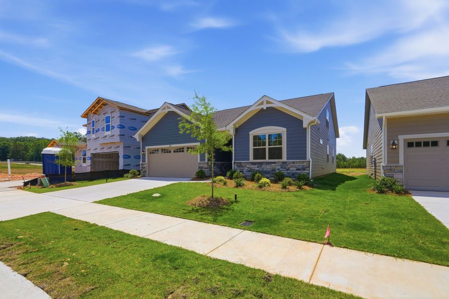 Front exterior of a new home in Westfall, Gastonia, NC, highlighting curb appeal (Image 2). Front exterior of a new home in Westfall, Gastonia, NC, highlighting curb appeal (Image 2).