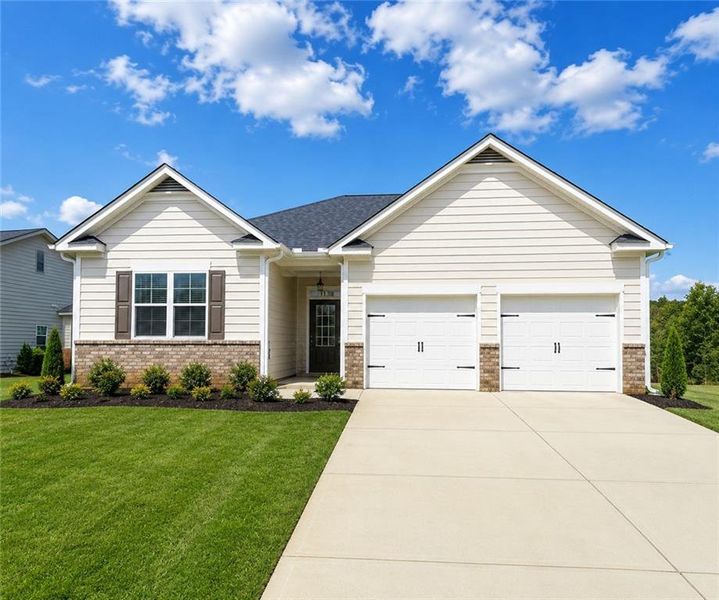 Front exterior of a new home in , Homer, GA, highlighting curb appeal (Image 1). Front exterior of a new home in , Homer, GA, highlighting curb appeal (Image 1).