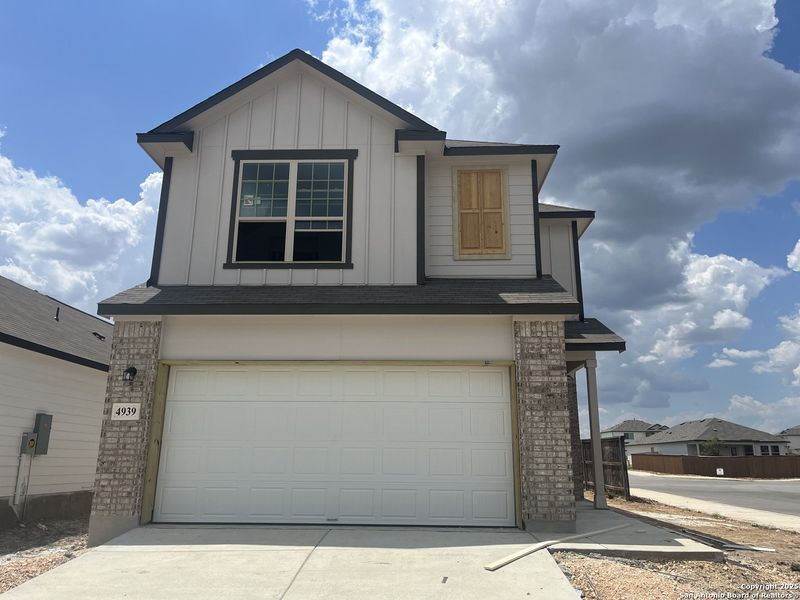 Front exterior of a new home in Blue Ridge Ranch, San Antonio, TX, highlighting curb appeal (Image 2).