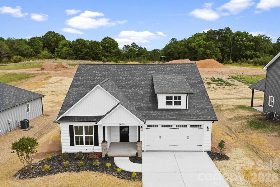Front exterior of a new home in , Albemarle, NC, highlighting curb appeal (Image 22).