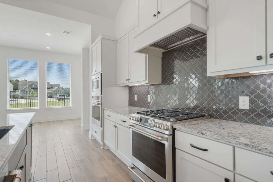 Representative furnished interior of a home built from the Malibu by Chesmar Homes in Fulshear Lakes, Fulshear (Image 10).