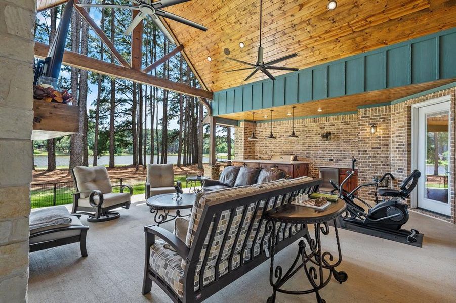The vaulted pitch resonates from the front porch, through the living room all the way through the back patio.  Again...beautiful views while you watch football and grill.  Serve on the 10' quartzite island.  All while you put your favorite music on the Sonos sound system.