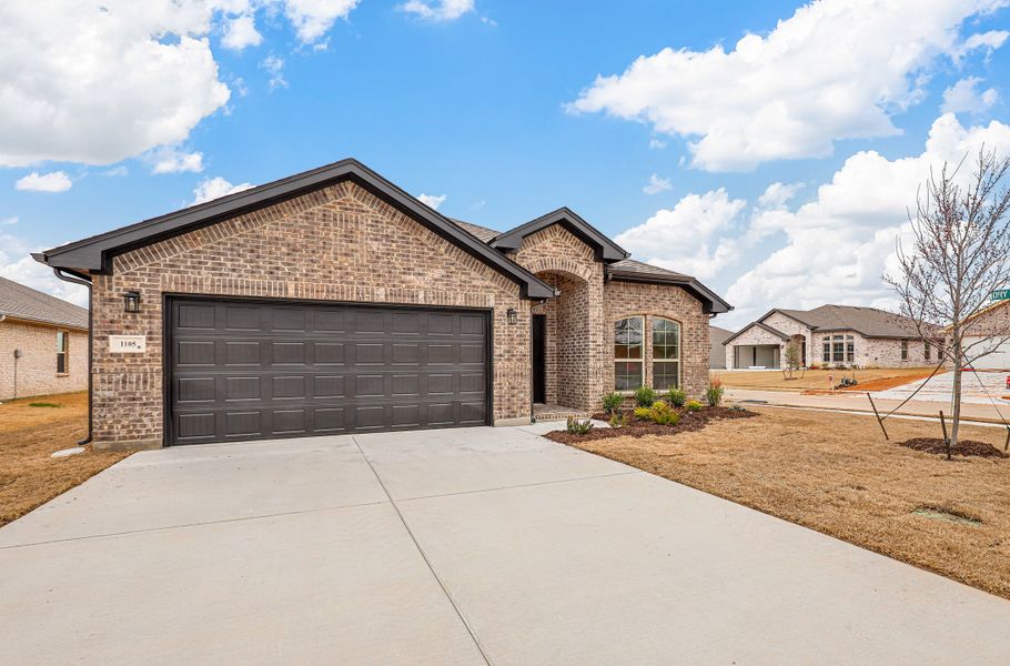 Representative exterior photo of a completed home built from the Devin by Cheldan Homes in Sunset Ridge, Keene, TX (Image 29). Representative exterior photo of a completed home built from the Devin by Cheldan Homes in Sunset Ridge, Keene, TX (Image 29).
