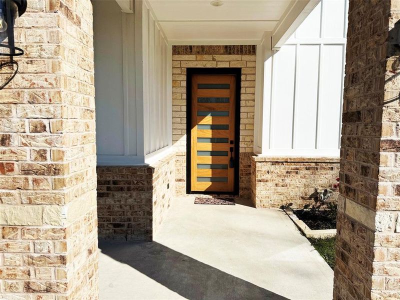 Property entrance with board and batten siding