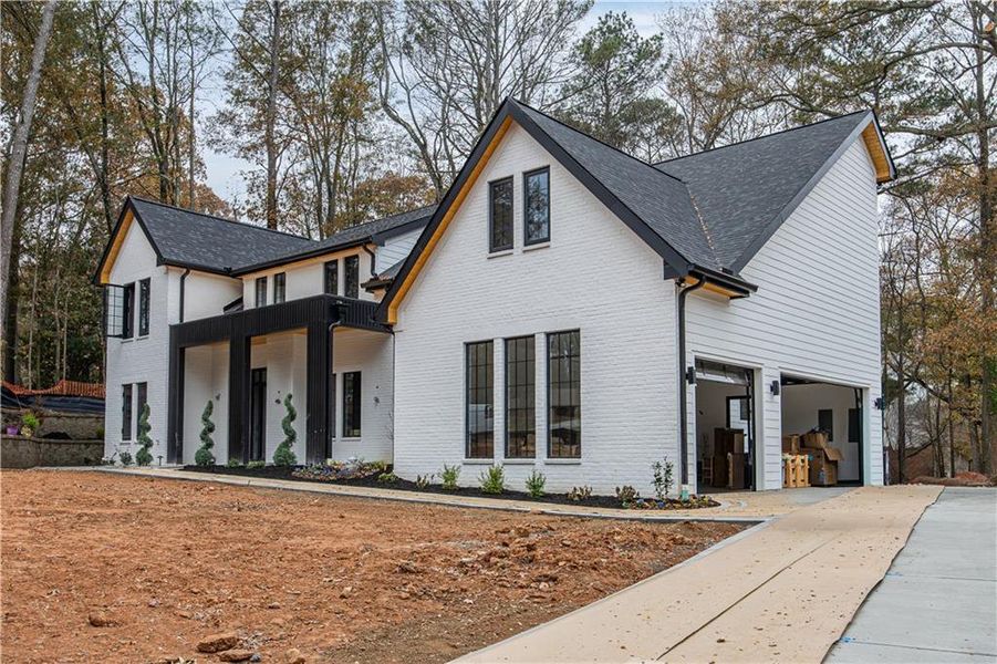 Front exterior of a new home in , Alpharetta, GA, highlighting curb appeal (Image 1).