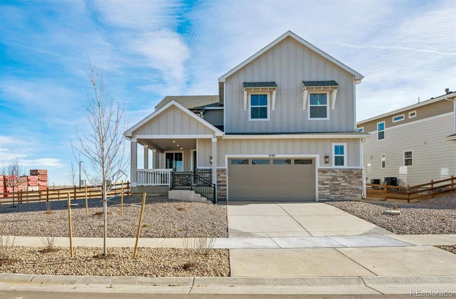Front exterior of a new home in Harvest Crossing, Aurora, CO, highlighting curb appeal (Image 1). Front exterior of a new home in Harvest Crossing, Aurora, CO, highlighting curb appeal (Image 1).
