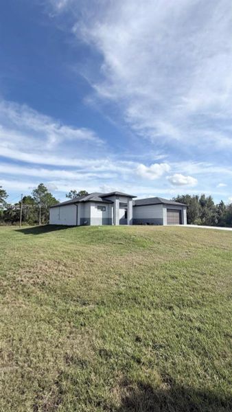 Exterior details and patio area of a home in , Lehigh Acres (Image 3). Exterior details and patio area of a home in , Lehigh Acres (Image 3).