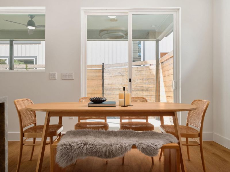 Dining area featuring healthy amount of natural light and wood finished floors Dining area featuring healthy amount of natural light and wood finished floors