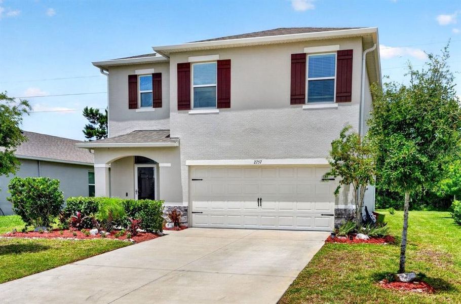 Front exterior of a new home in , Ormond Beach, FL, highlighting curb appeal (Image 26). Front exterior of a new home in , Ormond Beach, FL, highlighting curb appeal (Image 26).