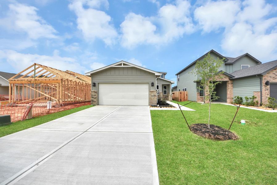 Front exterior of a new home in The Enclave at Spring Branch, Conroe, TX, highlighting curb appeal (Image 23).
