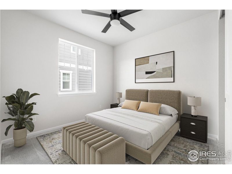 Main Level Bedroom 2, 12'5 x 10'6.This photo has been virtually staged to provide visual ideas for how furniture can be arranged in this area of the home.