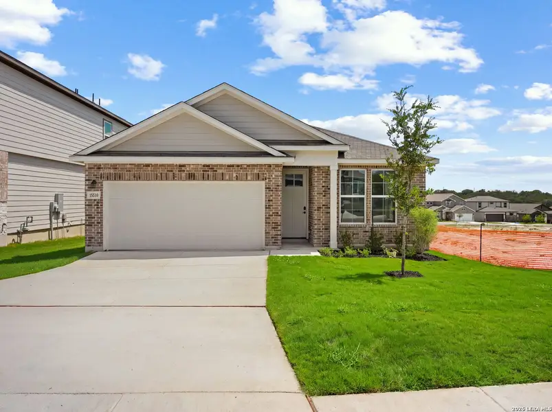 Front exterior of a new home in Hunter's Ranch, San Antonio, TX, highlighting curb appeal (Image 2). Front exterior of a new home in Hunter's Ranch, San Antonio, TX, highlighting curb appeal (Image 2).