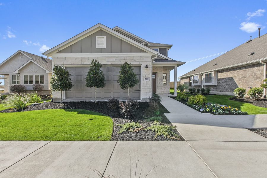 Front exterior of a new home in Crosswinds, Kyle, TX, highlighting curb appeal (Image 1). Front exterior of a new home in Crosswinds, Kyle, TX, highlighting curb appeal (Image 1).