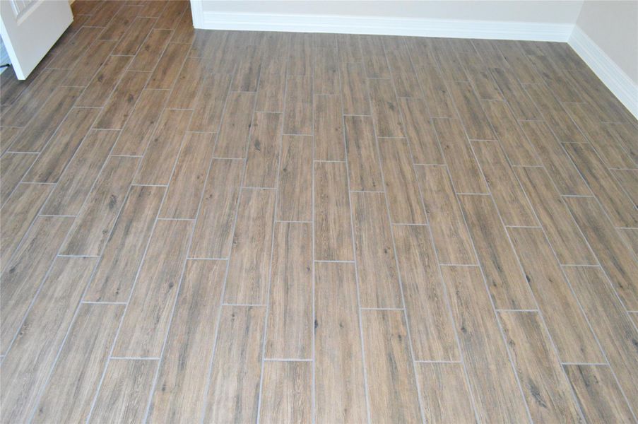 Detailed view of wood finished floors and baseboards