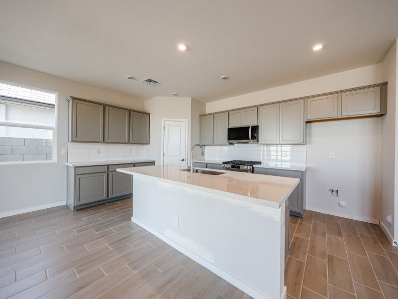 A kitchen with white cabinets. A kitchen with white cabinets.