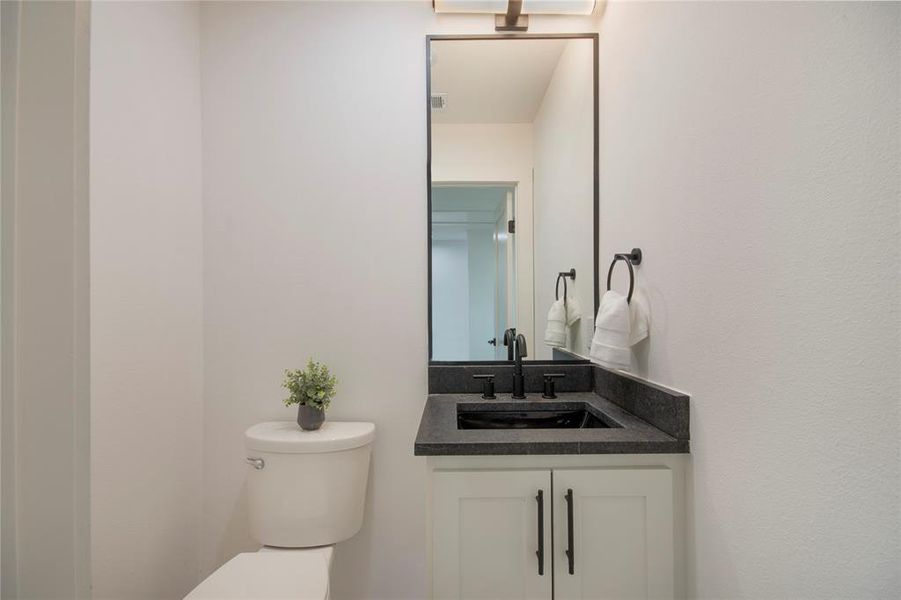 Bathroom featuring toilet and vanity