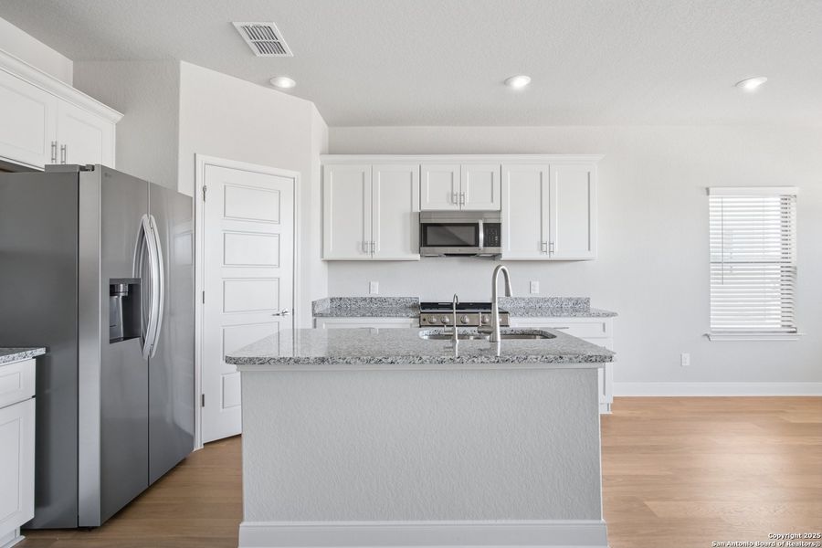 Furnished interior view inside a new home in Magnolia Village North, San Antonio (Image 7).