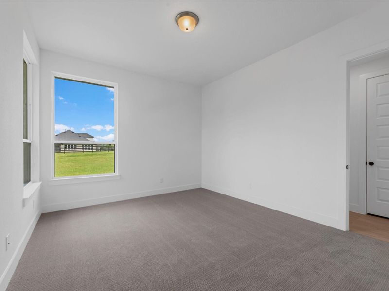 Spacious, unfurnished interior of a new home in The Estates at James Lane, Fulshear (Image 23).