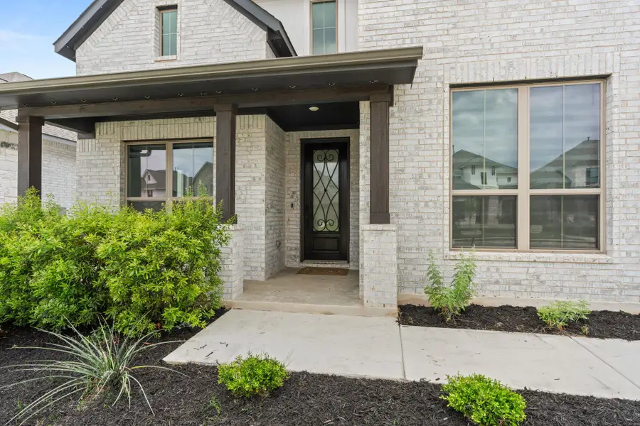 Exterior details and patio area of a home in Santa Rita Ranch, Liberty Hill (Image 3).