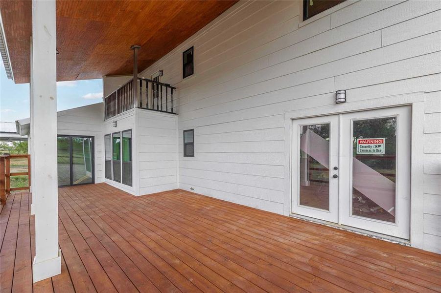 Wooden deck featuring french doors
