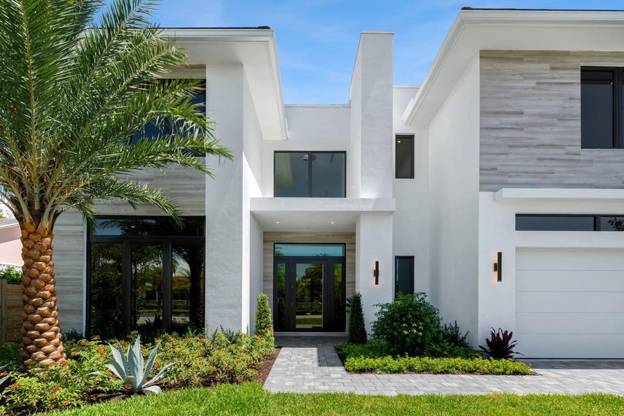 Front exterior of a new home in , West Palm Beach, FL, highlighting curb appeal (Image 2). Front exterior of a new home in , West Palm Beach, FL, highlighting curb appeal (Image 2).