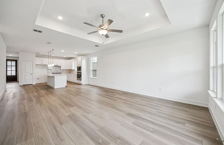 Airy gathering room showcases open concept floorplan *Real home pictured