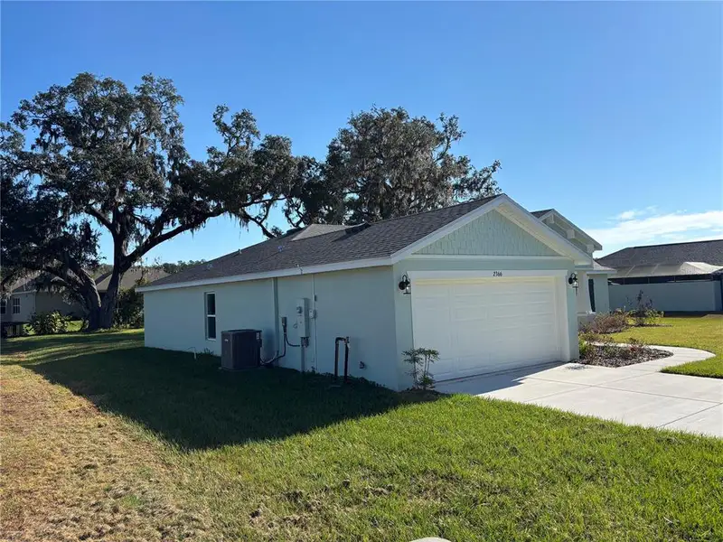 Front exterior of a new home in , Brooksville, FL, highlighting curb appeal (Image 2).