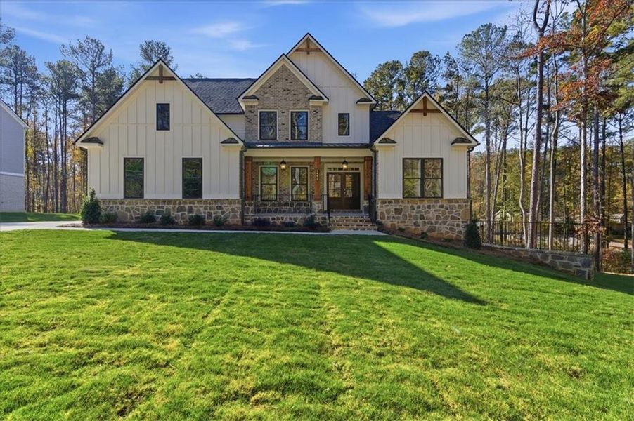 Front exterior of a new home in Ford Landing, Acworth, GA, highlighting curb appeal (Image 26). Front exterior of a new home in Ford Landing, Acworth, GA, highlighting curb appeal (Image 26).