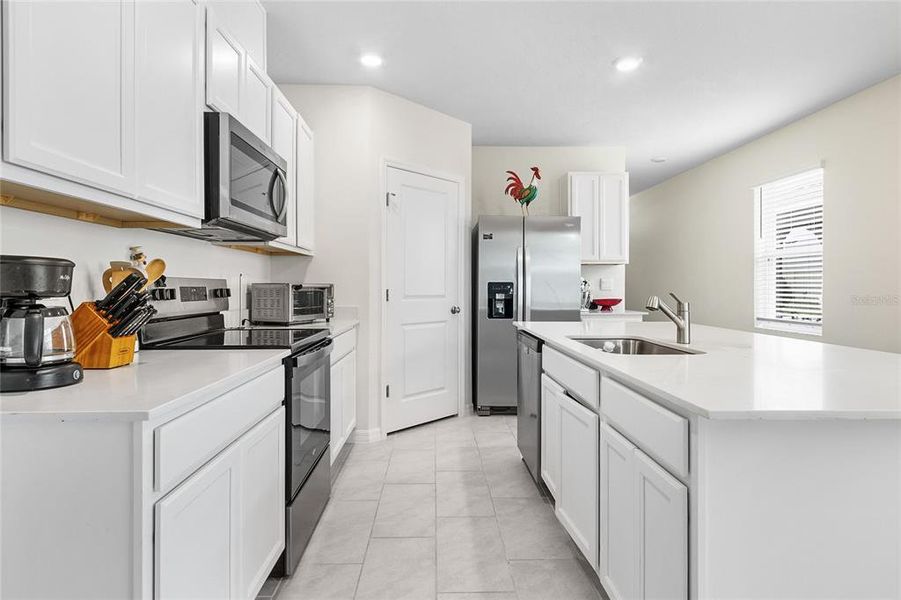 Furnished interior view inside a new home in Lake Deer Estates, Poinciana (Image 9).
