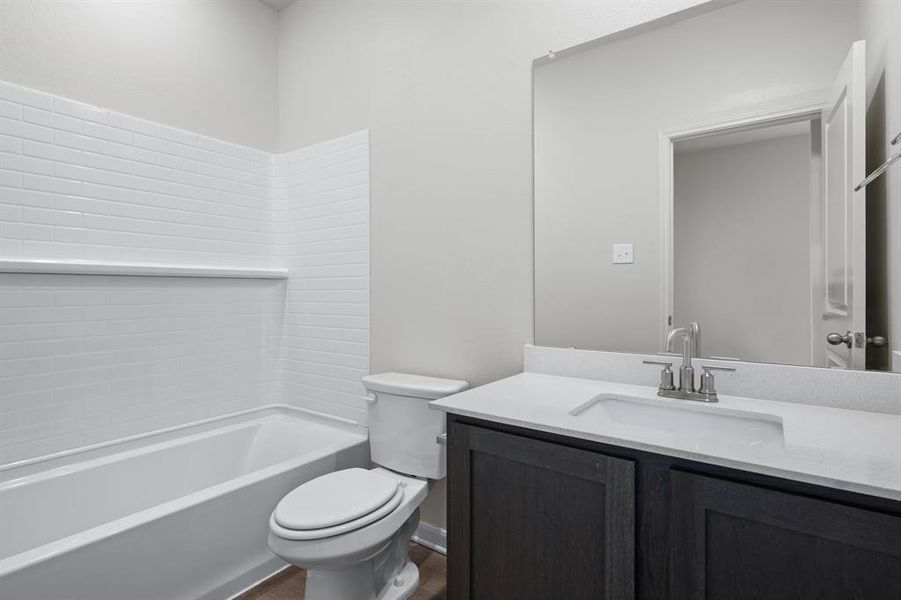 Bathroom featuring vanity and tub / shower combination