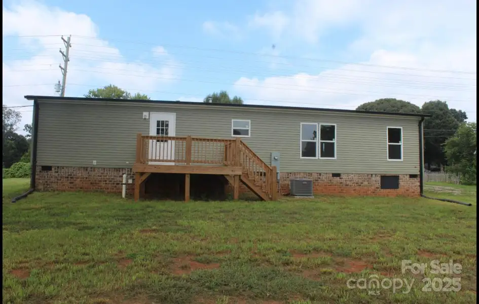 Front exterior of a new home in , Statesville, NC, highlighting curb appeal (Image 15).