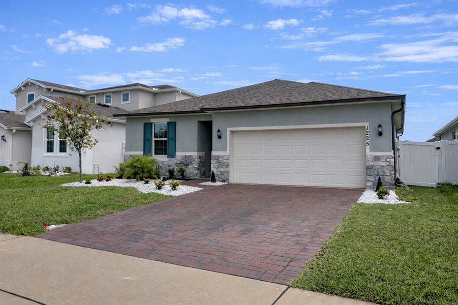 Front exterior of a new home in Prairie Oaks, St. Cloud, FL, highlighting curb appeal (Image 23).