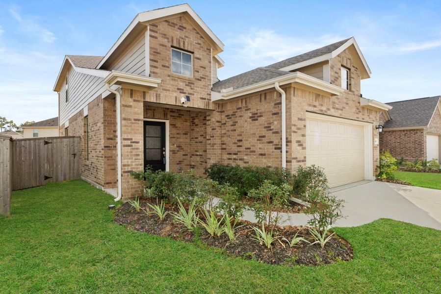 Exterior details and patio area of a home in Tavola: Gulf Coast Collection, New Caney (Image 26).