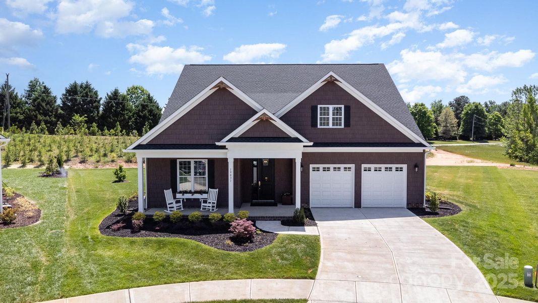 Front exterior of a new home in Bailey's Glen, Cornelius, NC, highlighting curb appeal (Image 2). Front exterior of a new home in Bailey's Glen, Cornelius, NC, highlighting curb appeal (Image 2).