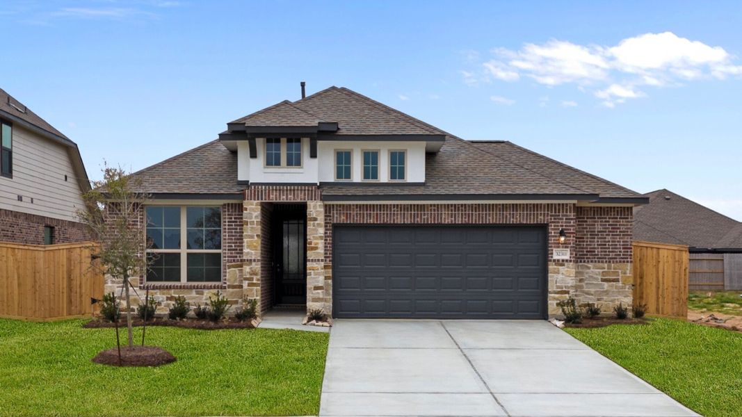 Welcome home to 32311 Tallow Creek Drive located in the Oakwood Estates community zoned to Waller ISD.