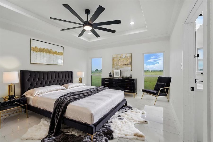 Bedroom with a raised ceiling, multiple windows, recessed lighting, crown molding, and a ceiling fan Bedroom with a raised ceiling, multiple windows, recessed lighting, crown molding, and a ceiling fan