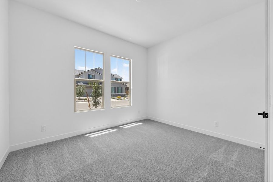 Spacious, unfurnished interior of a new home in Ellsworth Ranch, Queen Creek (Image 26).