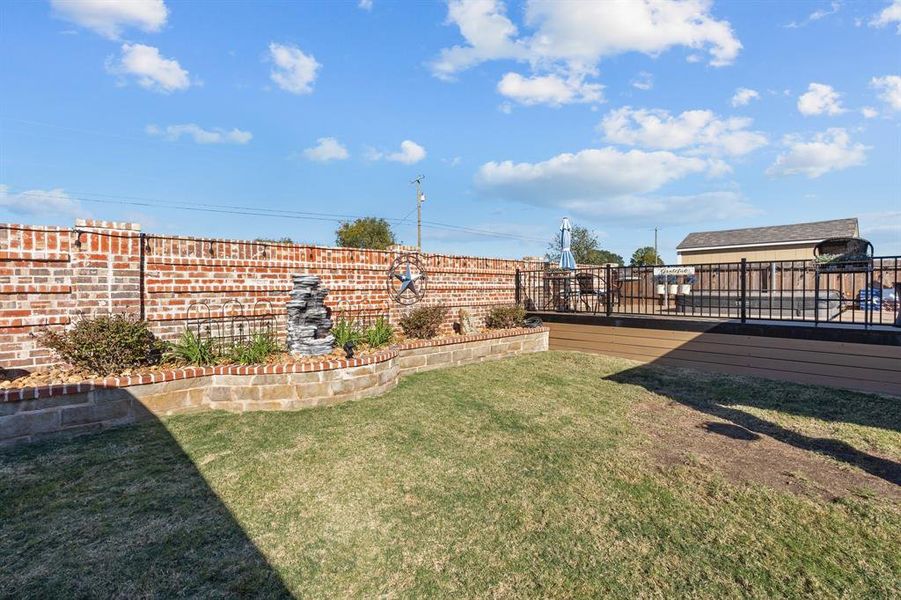 View of yard featuring a wooden deck