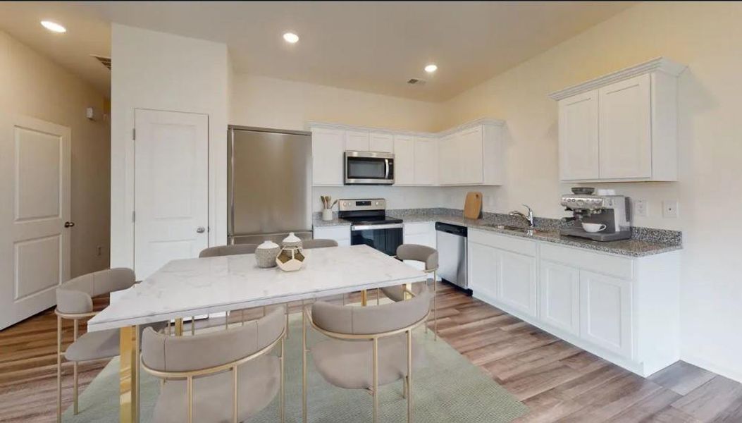 Furnished interior view inside a new home in Greyson Parc, Locust Grove (Image 1).