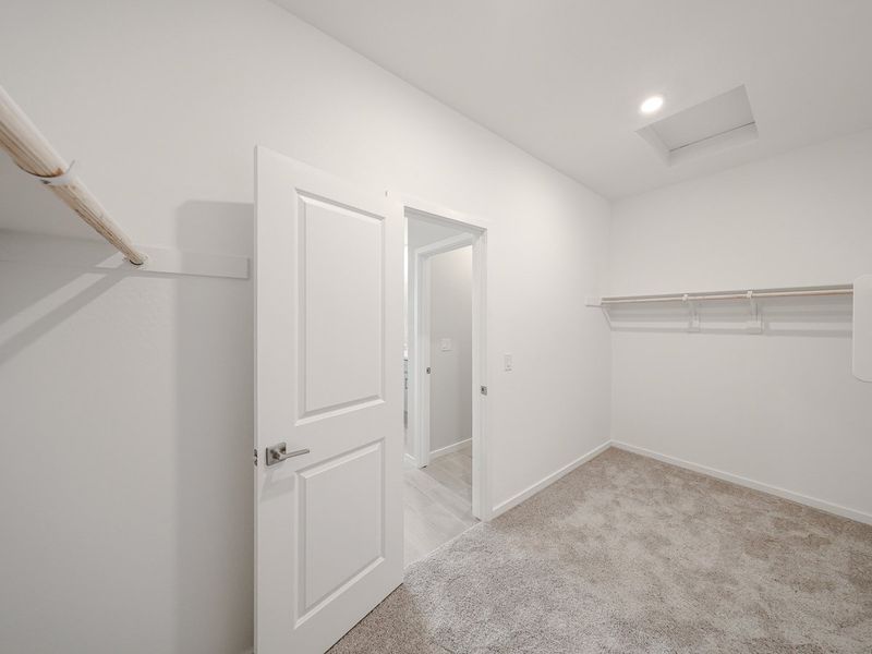 A hallway with white doors.