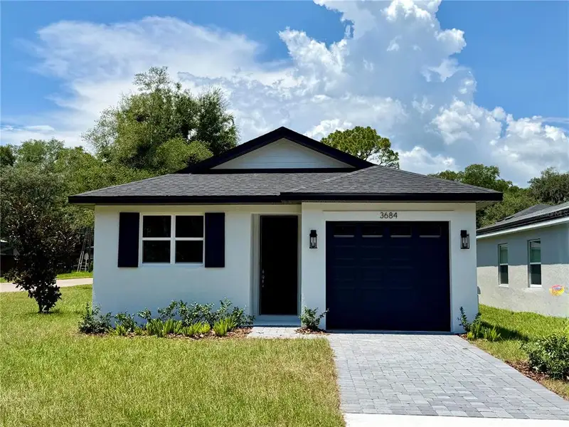Front exterior of a new home in , Apopka, FL, highlighting curb appeal (Image 2). Front exterior of a new home in , Apopka, FL, highlighting curb appeal (Image 2).